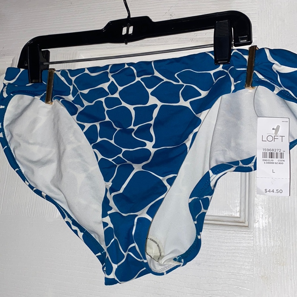 Brand New swimsuit bottom. Blue giraffe print. Size L